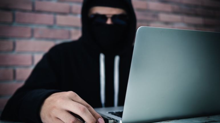 Ethical hacking concept displayed on digital screens with source code and cybersecurity interface